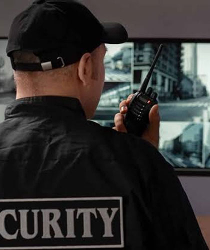 Security supervisor monitoring trained security guards at a commercial industrial premises in Ahmedabad